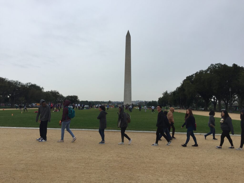 student in front of washington monument