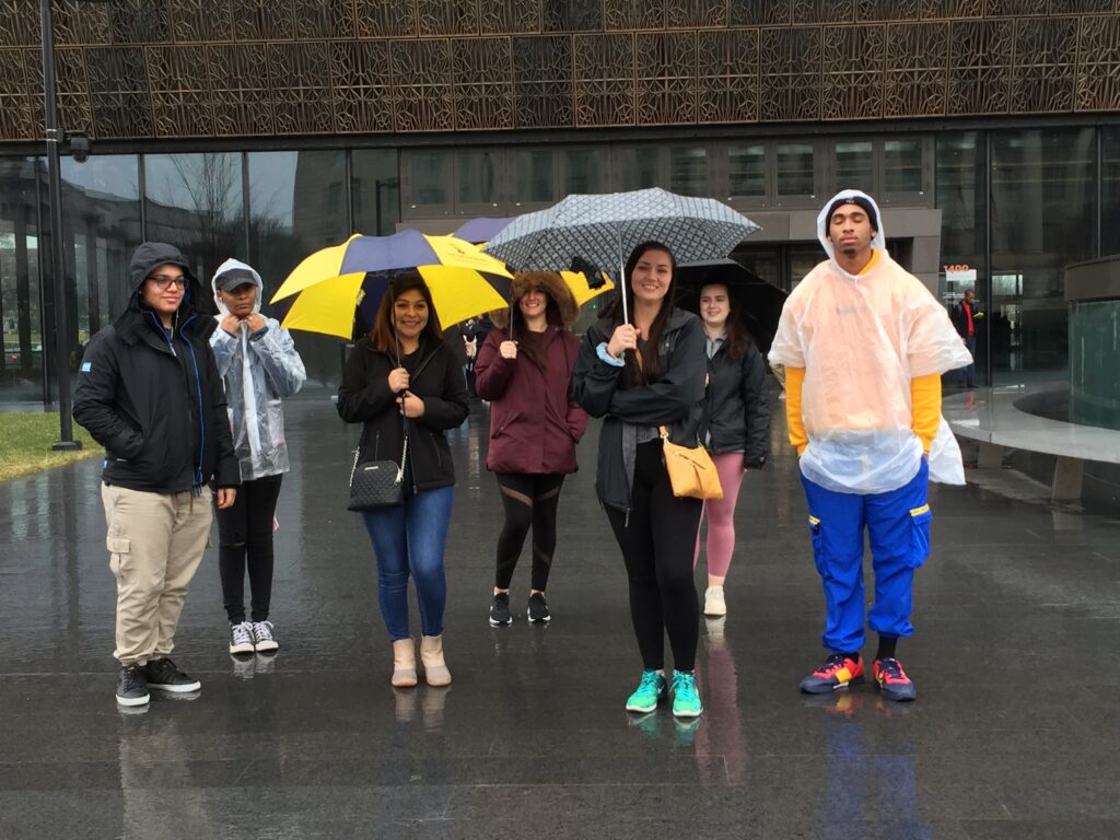 students with umbrellas